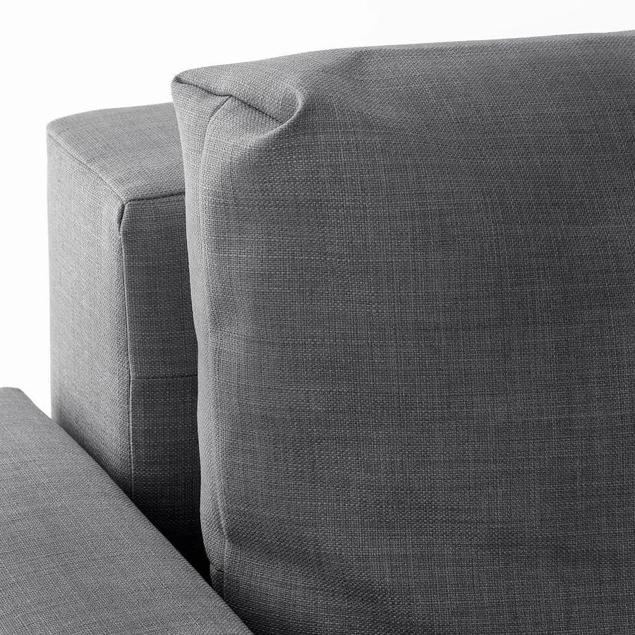 Close-up of the dark grey woven cover on a back cushion and the arm