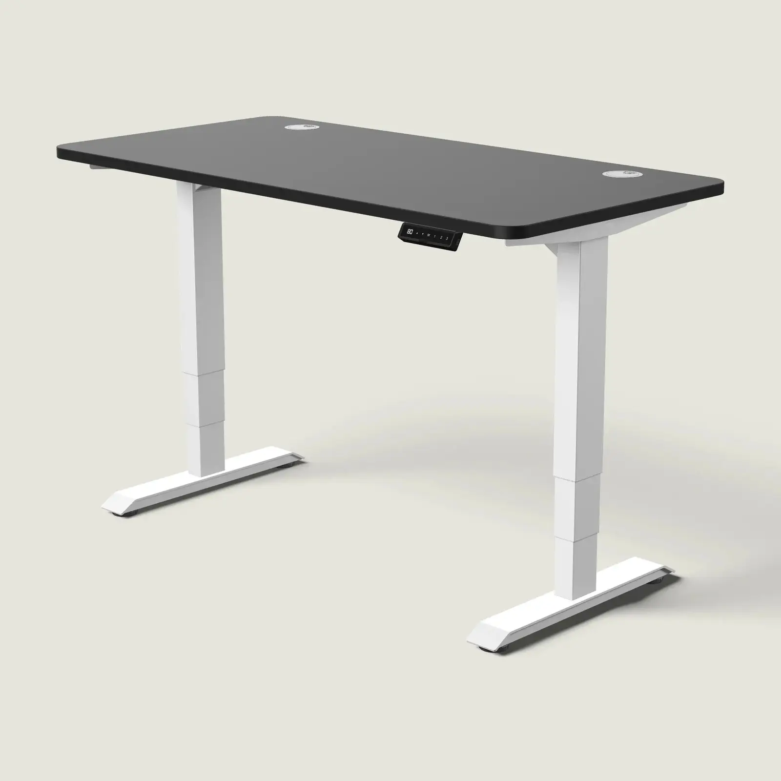 Electric standing desk, 140 × 70 cm, white frame and black top, with the memory handset under the front edge, on a pale grey background