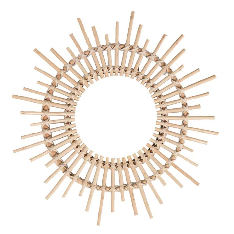 Round mirror with a sunburst rattan frame of spokes at varying lengths, on a white background